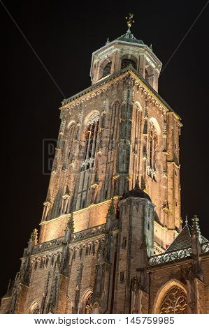 Illuminated Deventer Lebuinus church tower at night