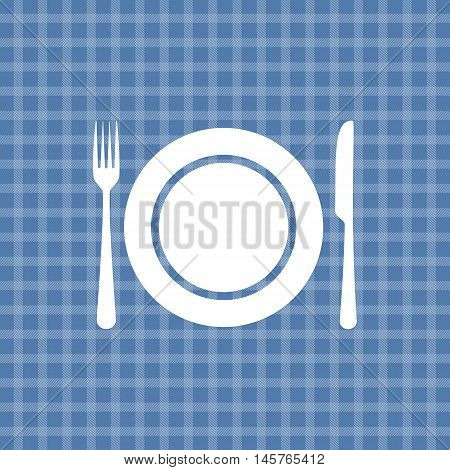 Plate knife and fork on blue picnic checkered tablecloth