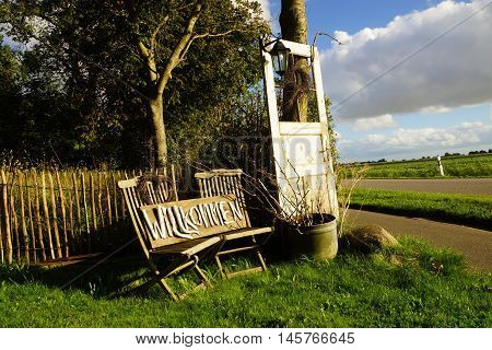 Old wooden door in front of a farm