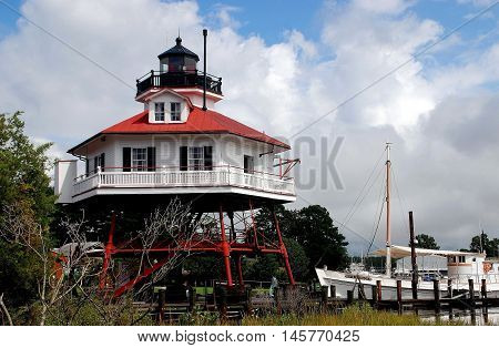 Solomon's Island Maryland - September 9 2011: Hexagonal 1883 Drum Point Lighthouse at the open-air Calvert Marine Museum