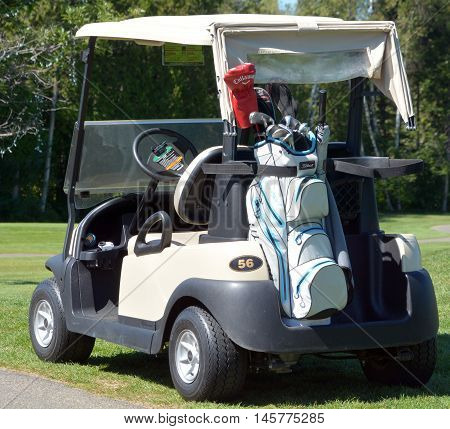 BROMONT QUEBEC CANADA 06 14 2016: Golf cart at the Royal Bromont Golf Club. The club offers an exceptional view of the surrounding mountains right in the heart of the City of Bromont