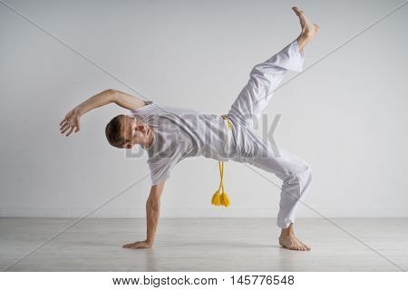 Man practicing capoeira , brazilian martial art.