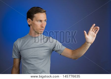 Man working with virtual touch screen.