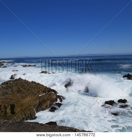 This is an image of the incoming tide and rocks at the Asilomar
State Reserve in Pacific Grove, California.