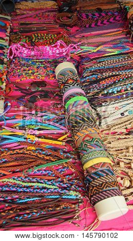 Banos de Agua Santa, Tungurahua / Ecuador - September 2 2016: Indian handmade bracelets sale at a craft store in the Pasaje Artesanal in the downtown of the city of Banos