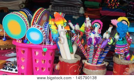 Banos de Agua Santa, Tungurahua / Ecuador - September 2 2016: crafts sale at a craft store in the Pasaje Artesanal in the downtown. Banos is located on the northern foothills of the Tungurahua volcano
