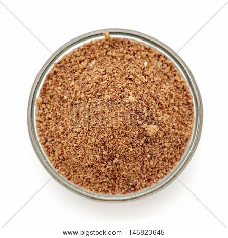 Organic powder of Indian Jujube (Ziziphus mauritiana) in a glass bowl. Isolated on white background. Top view.