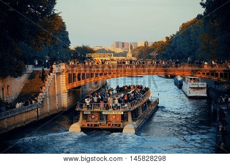 PARIS, FRANCE - MAY 13: Historical architecture and River Seine at sunset on May 13, 2015 in Paris. With the population of 2M, Paris is the capital and most-populous city of France