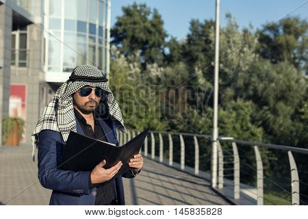 Oriental young businessman in the modern city