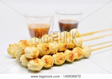 Meatball with thai spicy sauce isolated on white background