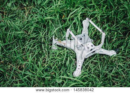 Crashed quadcopter after an accident laying on the ground