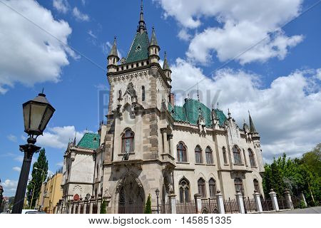 Jakab Palace (Kosice Slovakia) against blue sky and white clouds background.