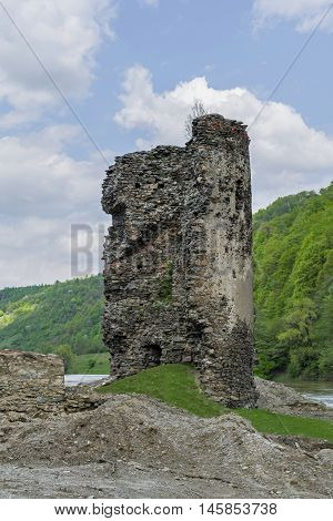 Medieval broken tower. Archaeological site on the Olt valley in Carpathian Mountains