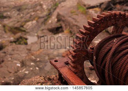 Rusted iron wheal at the coastline in the Faroe Islands
