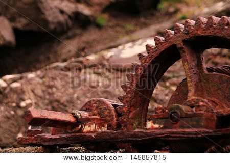 Rusted iron wheal at the coastline in the Faroe Islands