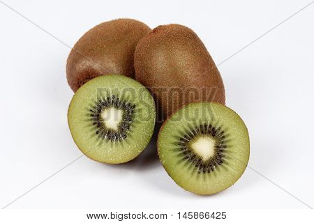 Kiwi fruit and halves on a white background. Selective focus.