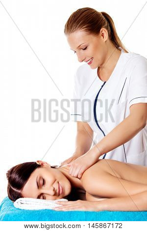 Woman having massage of body in the spa salon. Beauty treatment concept.