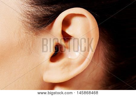 Close up photo of a female ear