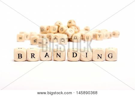 word with dice on white background - branding