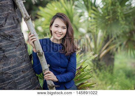 Thai Farmer Woman Wearing Typical Thai Dress, On Rice Fields Background, Identity Culture Of Thailan