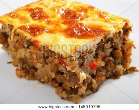 Vegetarian moussaka from lentils onion peppers and eggs. Horizontal shot