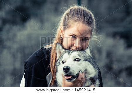Beautiful girl with a beautiful dog breed Siberian Husky