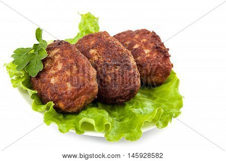 Meat patties with fresh lettuce isolated on a white background.