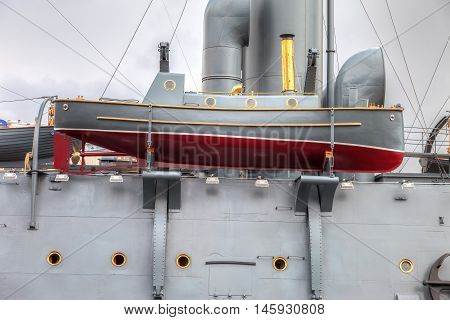 ST. PETERSBURG RUSSIA - JULY 29 2016: Lifeboat of the legendary revolutionary cruiser Aurora at the place of eternal parking on the Petrograd embankment