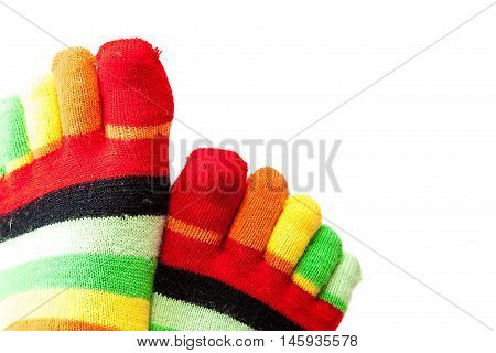 Funny colored socks female legs isolated on a white background.