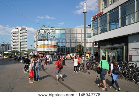 BERLIN, GERMANY - MAY 10, 2016: street scene in central Berlin at Alexanderplatz. Alexanderplatz is the most famous meeting point for tourists and residents of Berlin