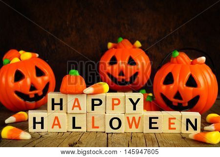 Happy Halloween Wooden Blocks With Candy Corn And Jack O Lantern Holders On An Orange And Black Back