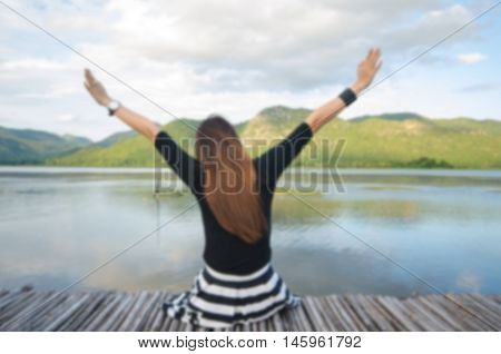 Blurred Background Of Alone Girl On Pier