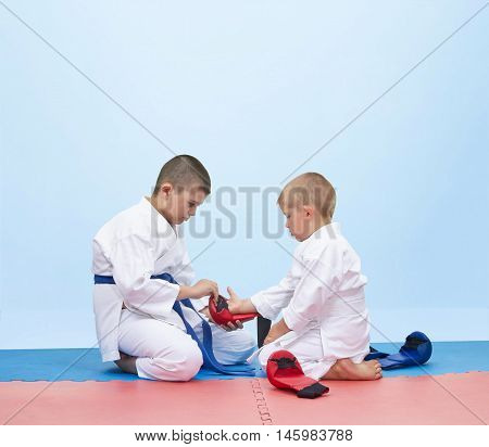 Karate athlete to dress overlays to another athlete