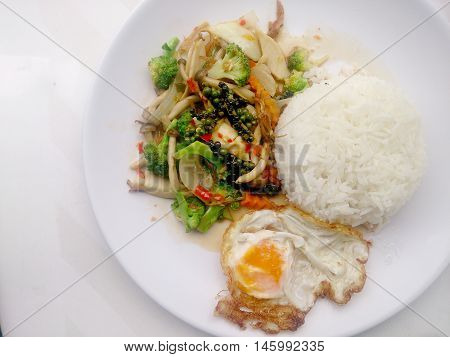 Stir-fried Black Pepper With Colorful Vegetables & Thai Jasmine Rice & Fried Egg In White Dish Isola