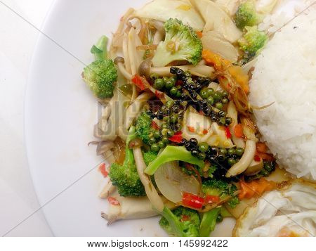 Stir-fried Black Pepper With Colorful Vegetables & Thai Jasmine Rice & Fried Egg In White Dish Isola