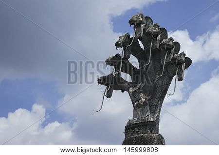 Buddhist Figurine spirituality sculpture from stone with seven snakes