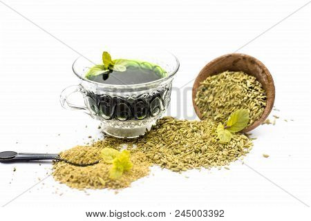 Raw Fennel With Its Powder And Its Beneficial Tea Or Extract In A Transparent Cup Isolated On White.