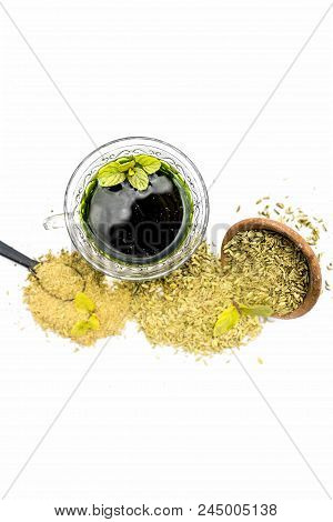 Raw Fennel With Its Powder And Its Beneficial Tea Or Extract In A Transparent Cup Isolated On White.