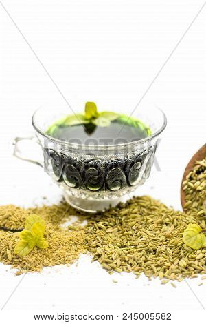 Raw Fennel With Its Powder And Its Beneficial Tea Or Extract In A Transparent Cup Isolated On White.