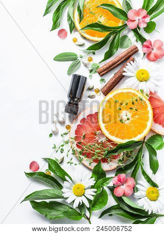 Essential Oil For Beauty Skin. Flat Lay Beauty Ingredients On A Light Background, Top View. Beauty H