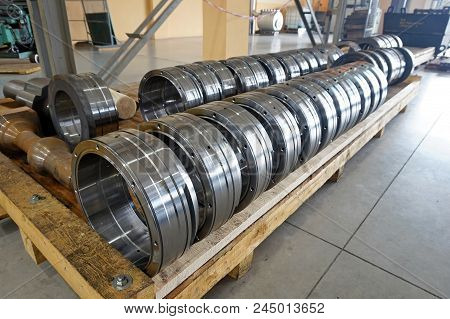 Cylindrical Metal Parts After Processing On The Rack