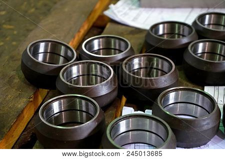 Cylindrical Metal Parts After Processing On The Rack
