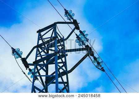 Photo Depicting One High-voltage Powerful Electricity Tower With Wires On Cloudy Blue Bright Sky.