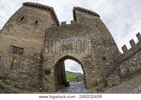 Genoese Fortress In Sudak, Crimea. Entrance To The Fortress, Protected By Two Gate Towers. Early Apr