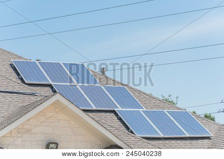 Solar Panel Installation On Asphalt Shingles Rooftop