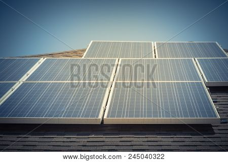 Solar Panel Installation On Asphalt Shingles Rooftop