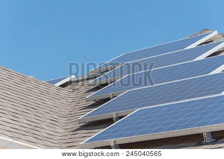 Solar Panel Installation On Asphalt Shingles Rooftop