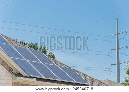 Solar Panel Installation On Asphalt Shingles Rooftop