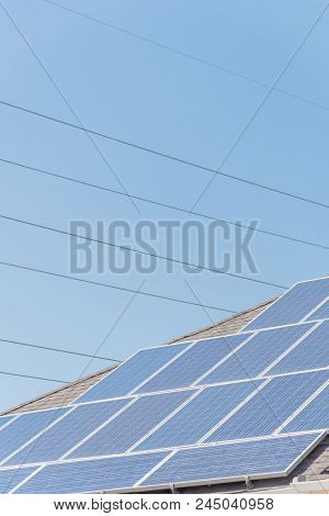 Solar Panel Installation On Asphalt Shingles Rooftop