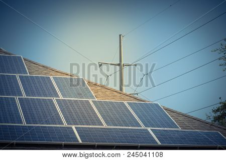 Solar Panel Installation On Asphalt Shingles Rooftop